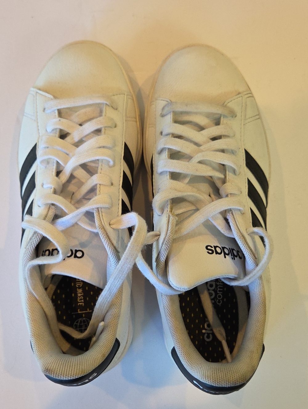Adidas Women’s White Sneakers with Black Stripes